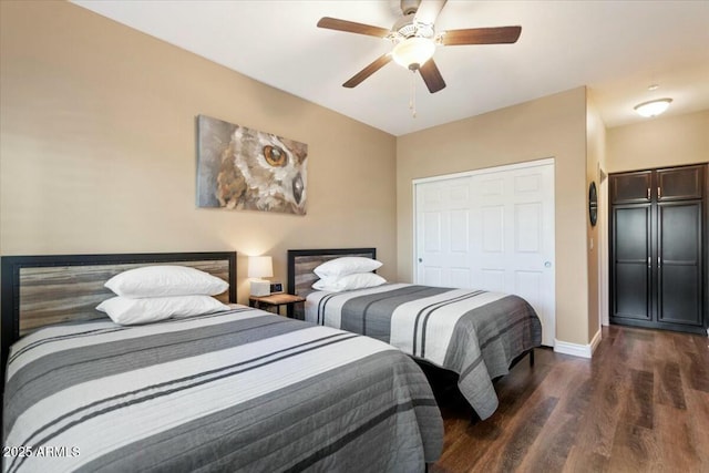 bedroom with a closet, ceiling fan, and dark wood-type flooring