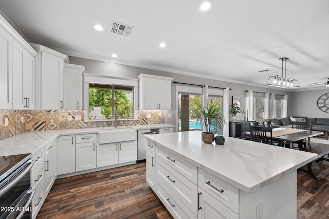 824 E Chelsea Dr, San Tan Valley, AZ 85140 - kitchen with dark wood-style flooring, crown molding, and appliances with stainless steel finishes