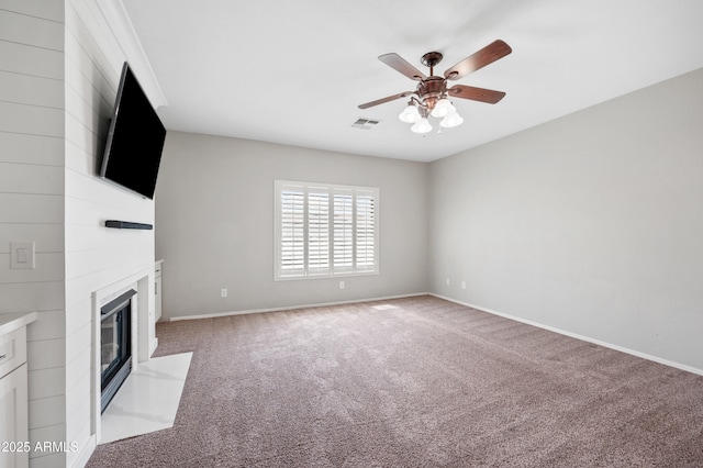 824 E Chelsea Dr, San Tan Valley, AZ 85140 - unfurnished living room with a fireplace with flush hearth, ceiling fan, baseboards, and light carpet