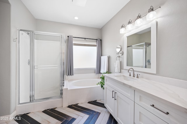 824 E Chelsea Dr, San Tan Valley, AZ 85140 - full bathroom featuring vanity, a bath, and a shower stall