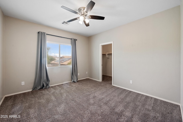 824 E Chelsea Dr, San Tan Valley, AZ 85140 - unfurnished bedroom featuring carpet flooring, a spacious closet, baseboards, visible vents, and ceiling fan