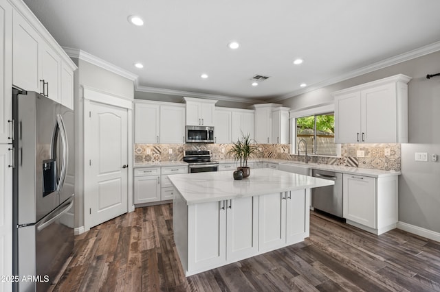 824 E Chelsea Dr, San Tan Valley, AZ 85140 - kitchen featuring a center island, white cabinets, and stainless steel appliances