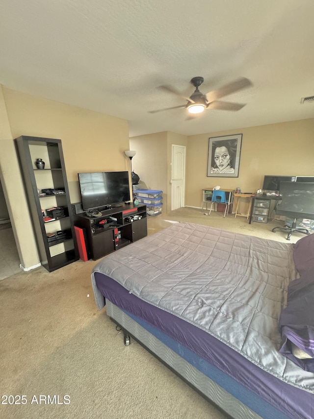 bedroom with visible vents, ceiling fan, and carpet floors