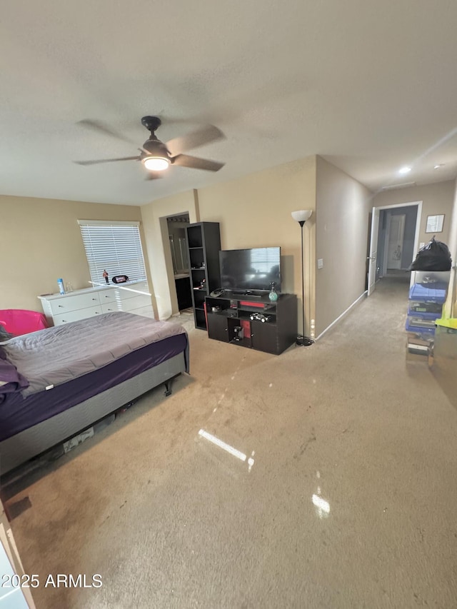 carpeted bedroom featuring a ceiling fan