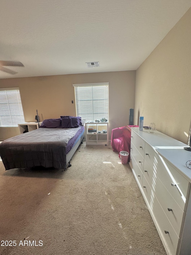 bedroom with carpet and visible vents