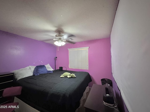 bedroom featuring a textured ceiling and ceiling fan