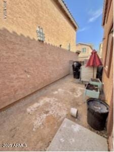 view of patio featuring fence