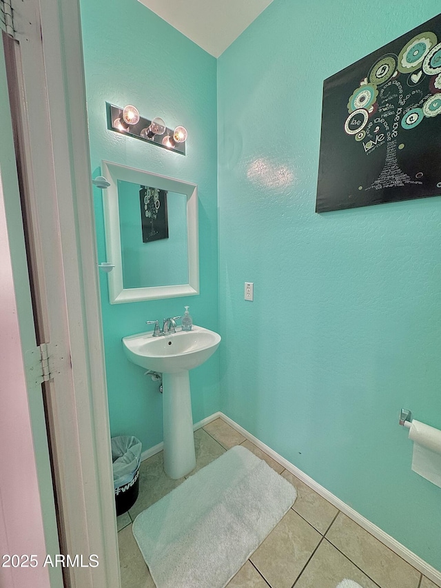 bathroom featuring tile patterned floors and baseboards