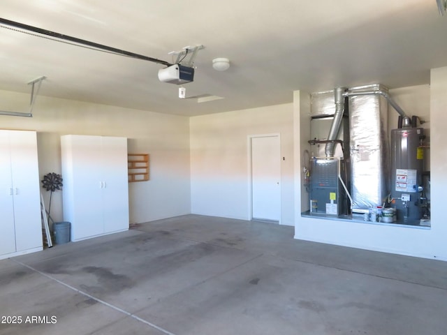 garage featuring water heater and a garage door opener