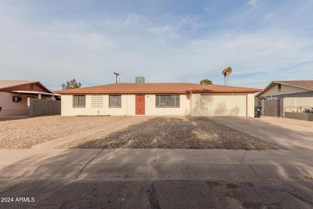 single story home with a garage