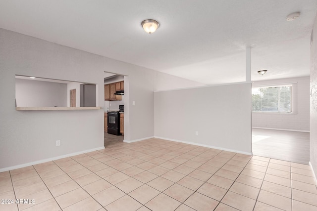 unfurnished living room featuring light tile patterned flooring