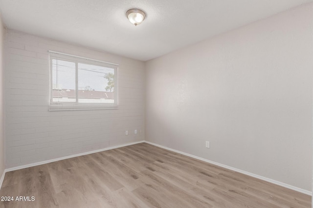 spare room featuring light hardwood / wood-style flooring