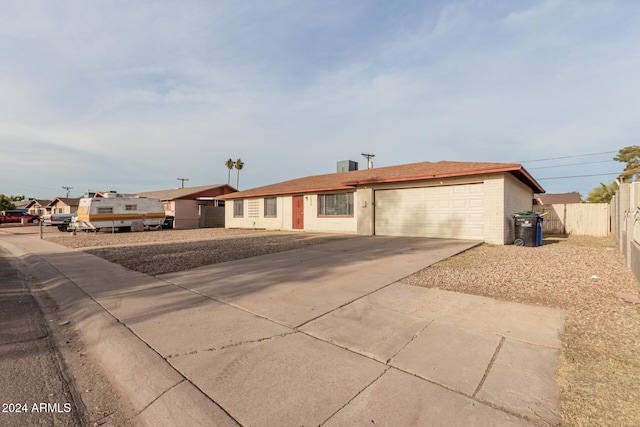 ranch-style home featuring a garage