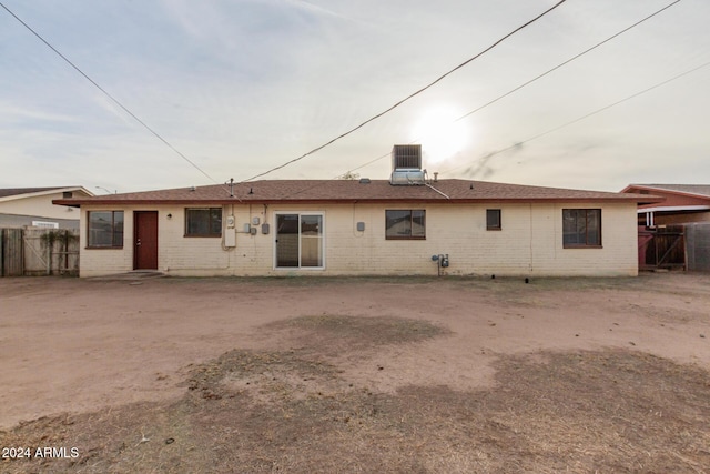 rear view of property featuring central AC unit