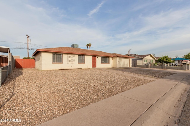 ranch-style home featuring a garage