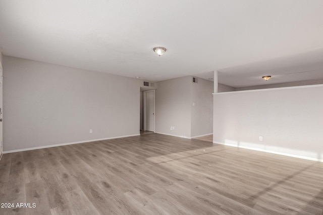 unfurnished room with light hardwood / wood-style flooring