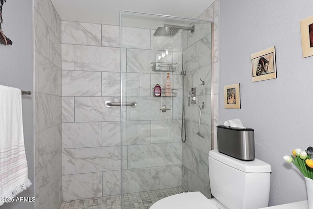full bathroom featuring toilet and a stall shower