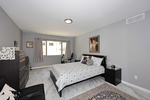 bedroom featuring visible vents, marble finish floor, and baseboards