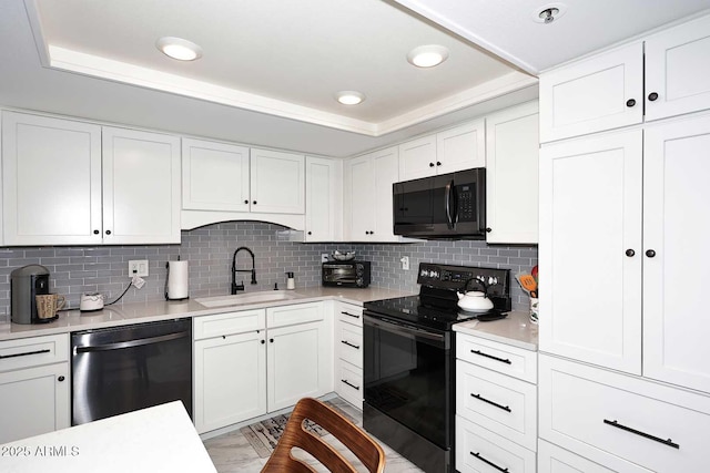 kitchen with white cabinetry, decorative backsplash, black electric range oven, a sink, and dishwashing machine