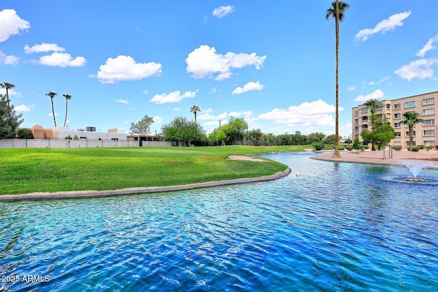 view of water feature with fence