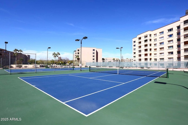 view of sport court featuring fence and community basketball court