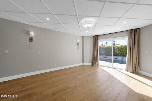 9136 N 81st St, Scottsdale, AZ 85258 - unfurnished room with light hardwood / wood-style floors and a drop ceiling