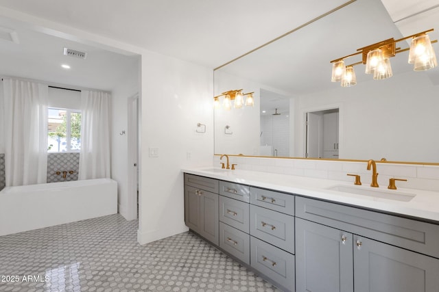 9136 N 81st St, Scottsdale, AZ 85258 - bathroom featuring vanity, a bathing tub, and backsplash