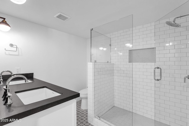 9136 N 81st St, Scottsdale, AZ 85258 - bathroom featuring a shower with door, vanity, and toilet