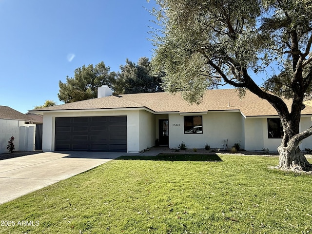 single story home with a garage and a front yard