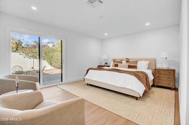 bedroom with access to outside and light hardwood / wood-style floors