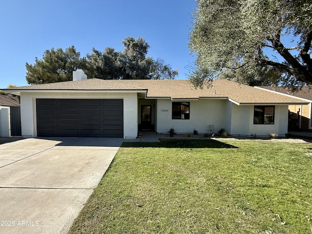 ranch-style house with a garage and a front yard