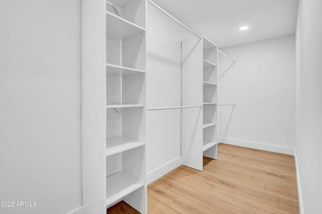 walk in closet featuring hardwood / wood-style flooring