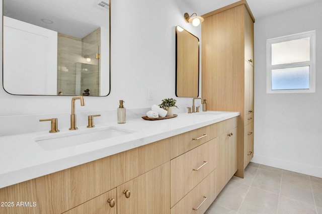 bathroom with walk in shower, tile patterned floors, and vanity