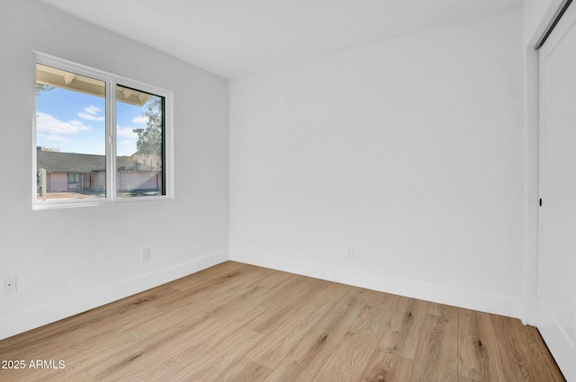 spare room featuring light hardwood / wood-style flooring