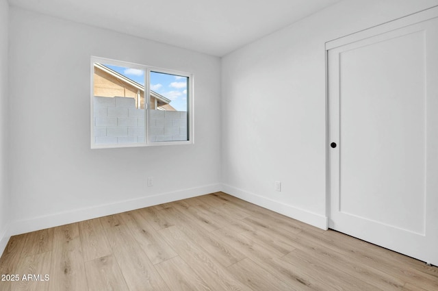 spare room featuring light hardwood / wood-style floors