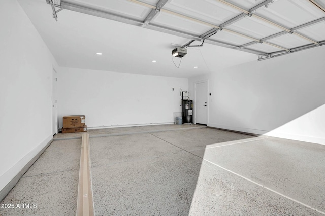 garage featuring a garage door opener and electric water heater