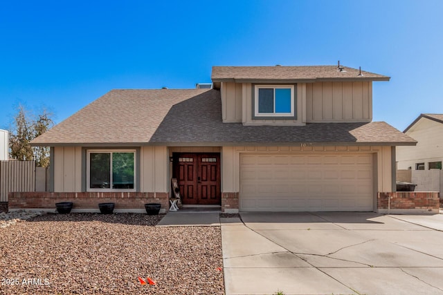 view of front of property featuring fence, roof with shingles, concrete driveway, a garage, and brick siding