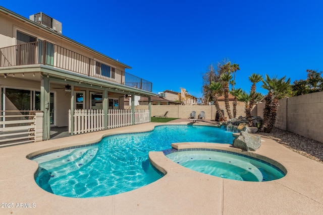 view of pool featuring ceiling fan, a patio, an in ground hot tub, and a fenced backyard