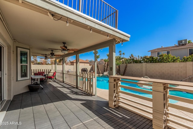 exterior space featuring ceiling fan, a fenced in pool, a patio, and a fenced backyard