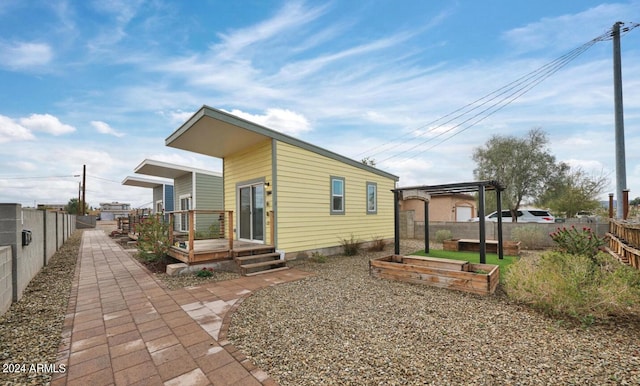 rear view of property featuring a patio