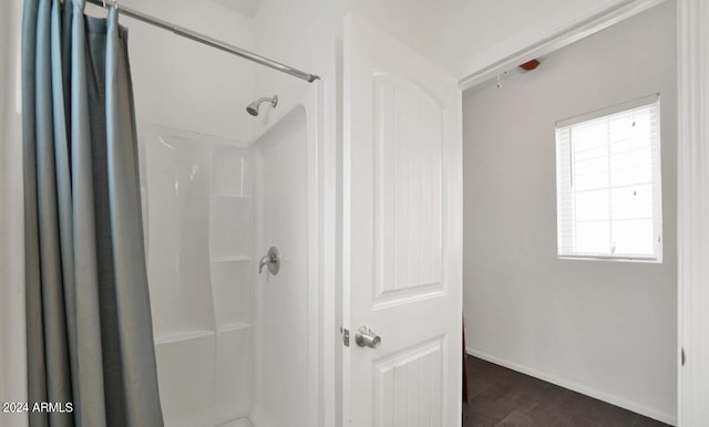 bathroom featuring a shower with curtain and hardwood / wood-style floors