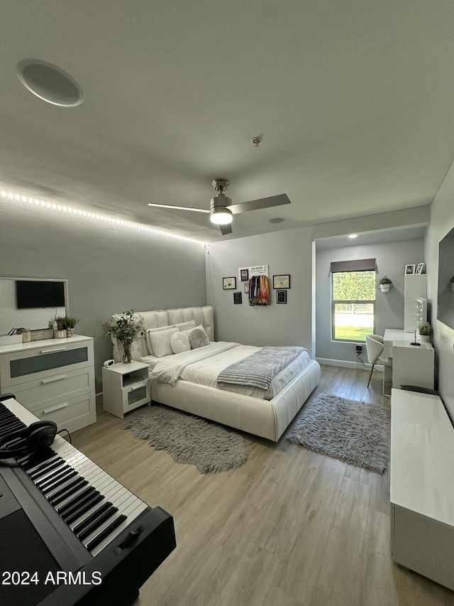 2311 E Colter St, Phoenix, AZ 85016 - bedroom featuring wood finished floors, a ceiling fan, and baseboards
