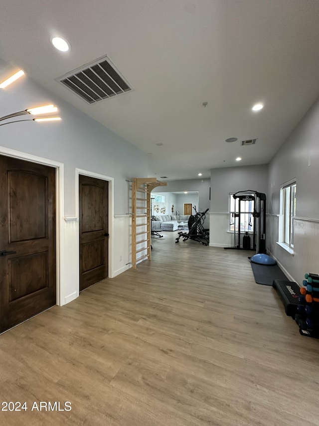 2311 E Colter St, Phoenix, AZ 85016 - exercise room with light wood finished floors, recessed lighting, and a wainscoted wall