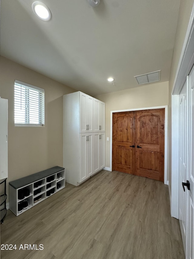 2311 E Colter St, Phoenix, AZ 85016 - unfurnished bedroom featuring light wood-type flooring, recessed lighting, and baseboards