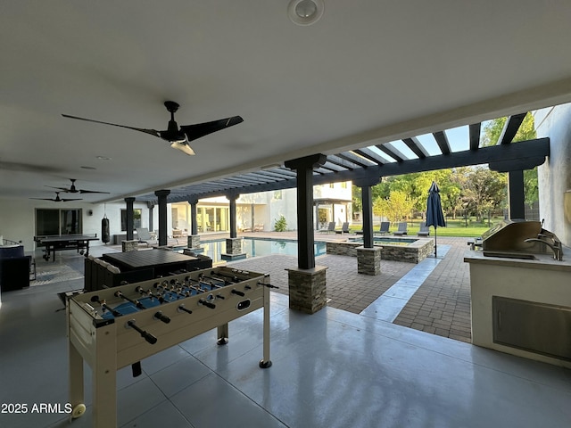 2311 E Colter St, Phoenix, AZ 85016 - view of patio with exterior kitchen, a ceiling fan, a pool with connected hot tub, and outdoor dining space