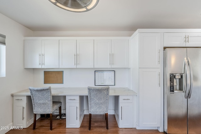 office area with wood finished floors and built in desk