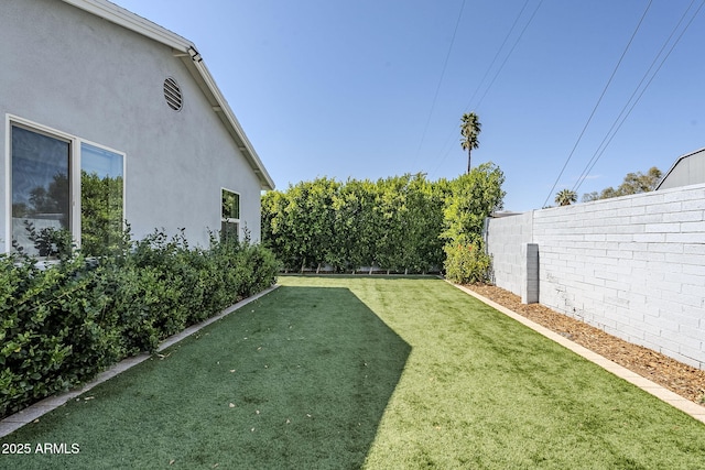 view of yard featuring a fenced backyard