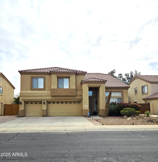 mediterranean / spanish-style home featuring a garage