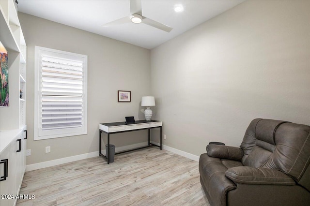 sitting room with light hardwood / wood-style flooring and ceiling fan