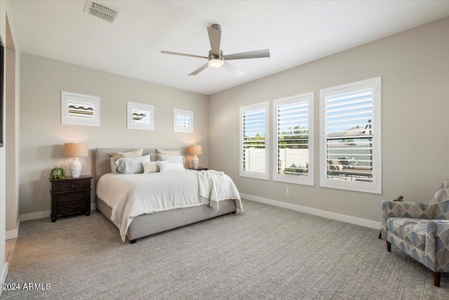 bedroom with ceiling fan and carpet